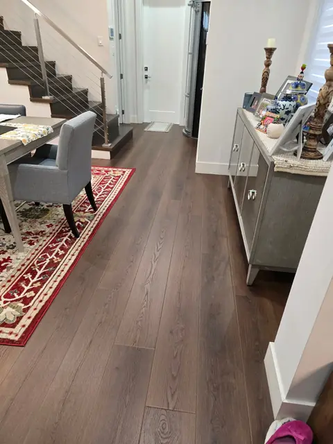 Dining room and staircase area with continuous LVP