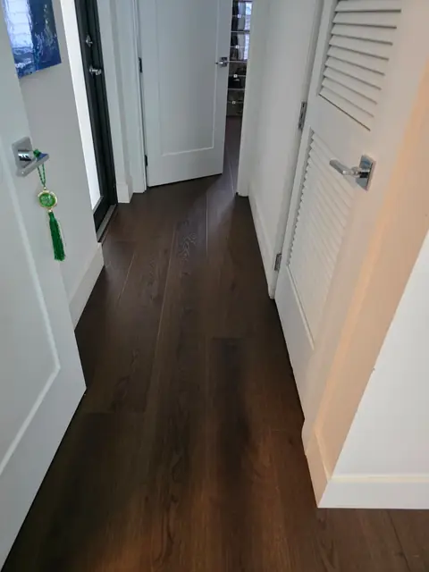 Hallway with wide-plank LVP leading to the bedrooms