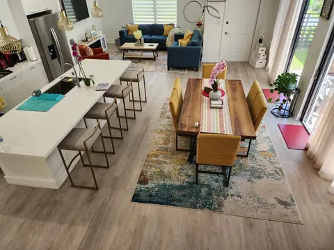 Living and dining room with seamless light oak LVP throughout