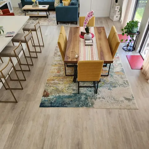 Dining area over new light oak vinyl plank flooring