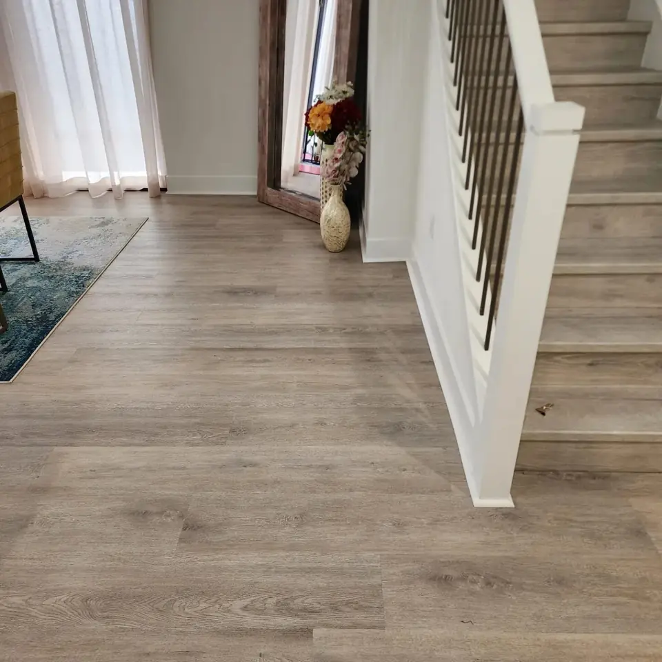 Staircase landing finished with matching luxury vinyl plank
