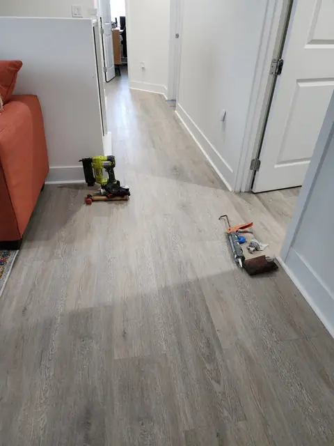 LVP installation in progress with installer tools in the hallway