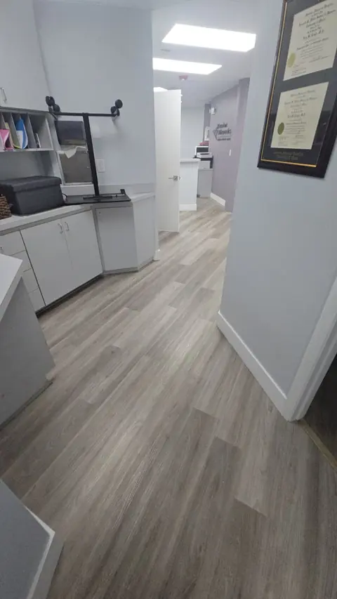 Light gray LVT installed through a medical office reception area