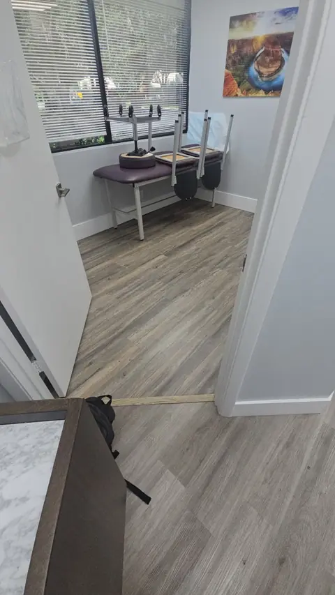 Treatment room with durable glue-down vinyl plank flooring