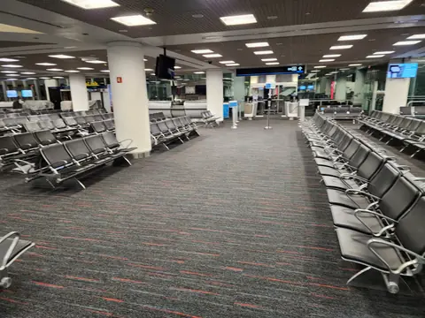 Finished commercial carpet tile across a Miami International Airport gate seating area