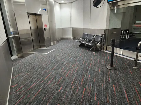 Elevator lobby at Miami International Airport with new carpet tile flooring