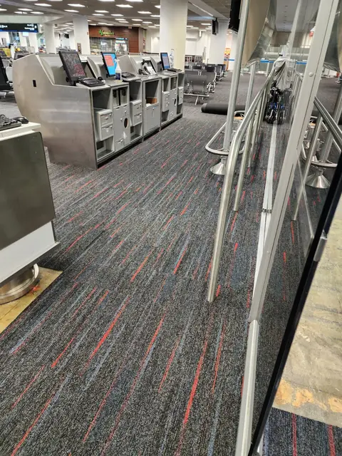 Airline gate counters at MIA with new carpet tile underfoot
