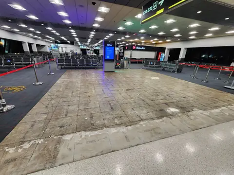 Airport gate area with old flooring removed and the substrate exposed before installation