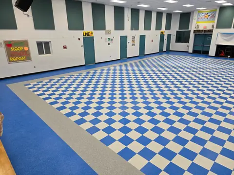 Corner detail of checkerboard VCT and blue border tile